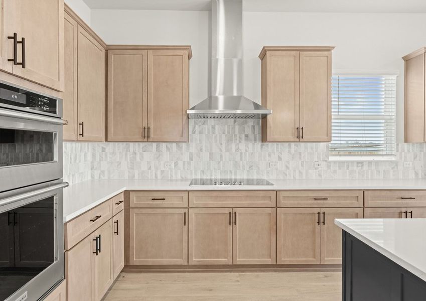 The kitchen has a beautiful backsplash.