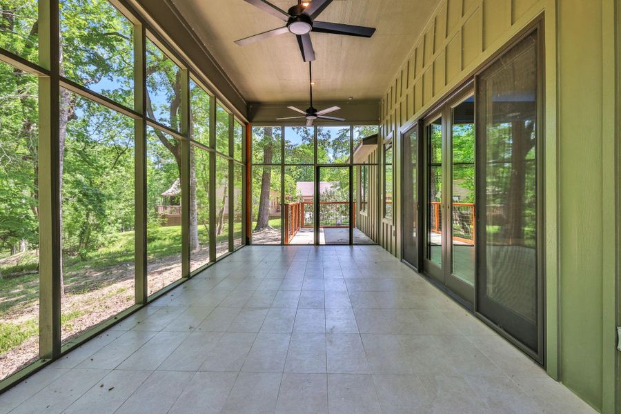 Flow from the living area to the spacious screened in porch that overlooks the property