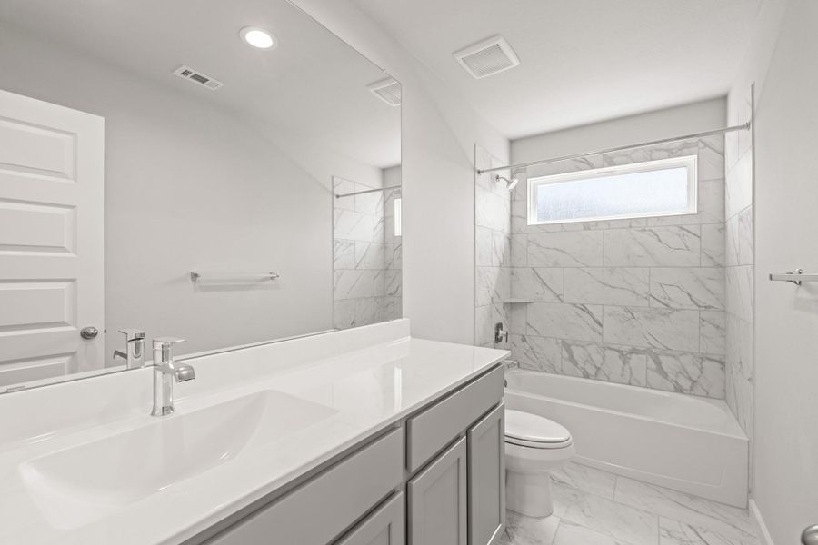 Furnished interior view inside a new home in Sunterra, Katy (Image 6).