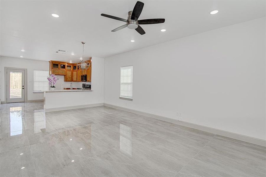 living room featuring recessed lighting and a ceiling fan