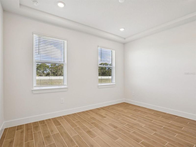 Spacious, unfurnished interior of a new home in Magnolia Bay - Reserve Series, Nokomis (Image 8).