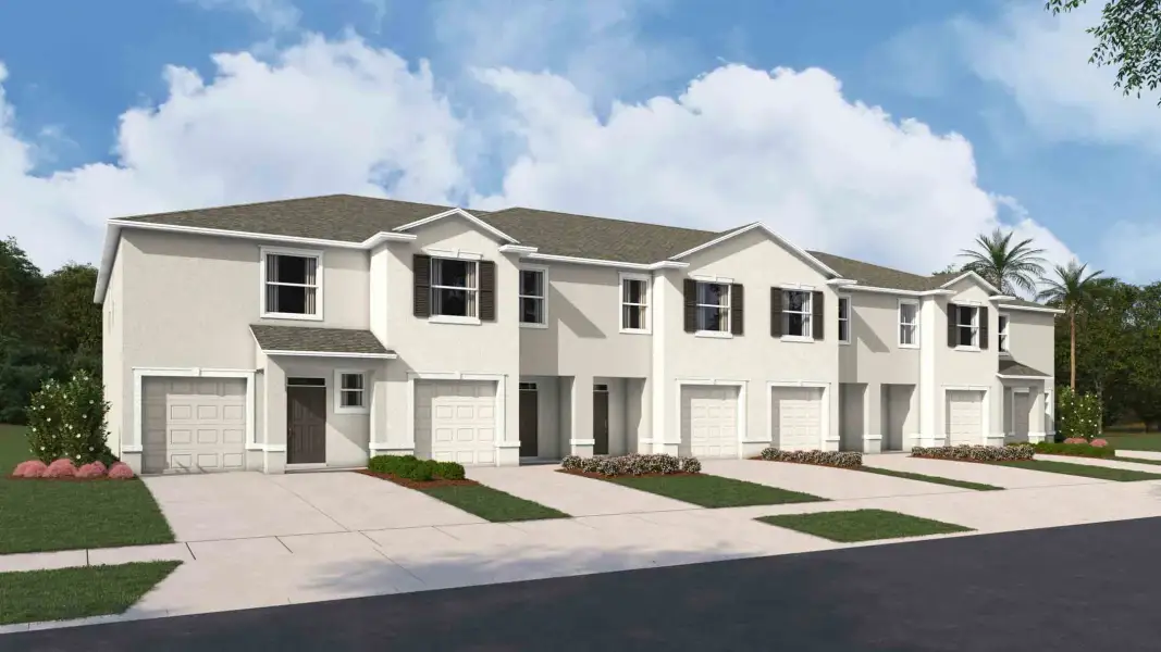 Front exterior of a new home in Towns at Woodsdale, Wesley Chapel, FL, highlighting curb appeal (Image 25).
