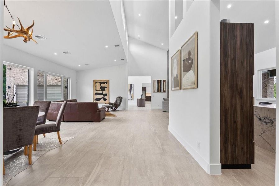 Soaring vaulted ceilings and 48 x 24 Italian tile flooring throughout create a sense of infinite space.