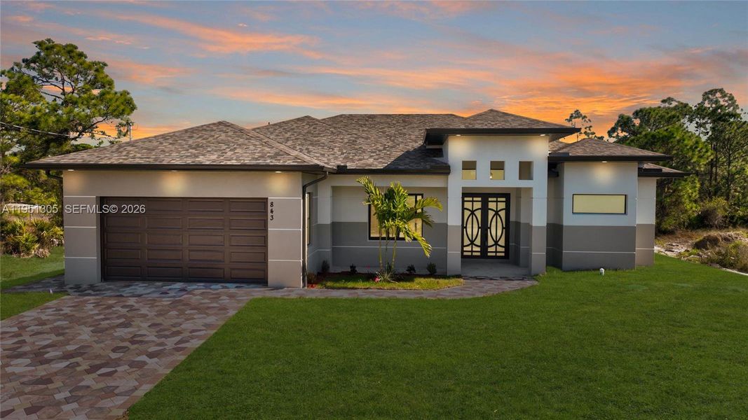 Front exterior of a new home in , Lehigh Acres, FL, highlighting curb appeal (Image 1). Front exterior of a new home in , Lehigh Acres, FL, highlighting curb appeal (Image 1).