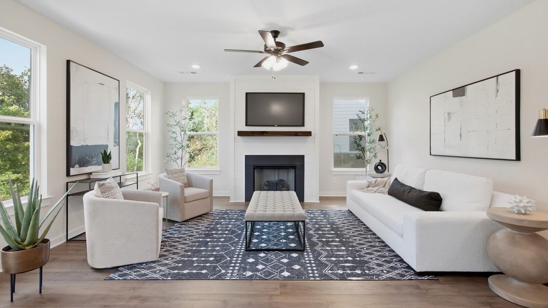 Living area with natural lighting and ceiling fan