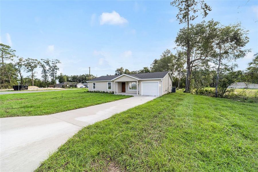 Front exterior of a new home in , Dunnellon, FL, highlighting curb appeal (Image 2). Front exterior of a new home in , Dunnellon, FL, highlighting curb appeal (Image 2).