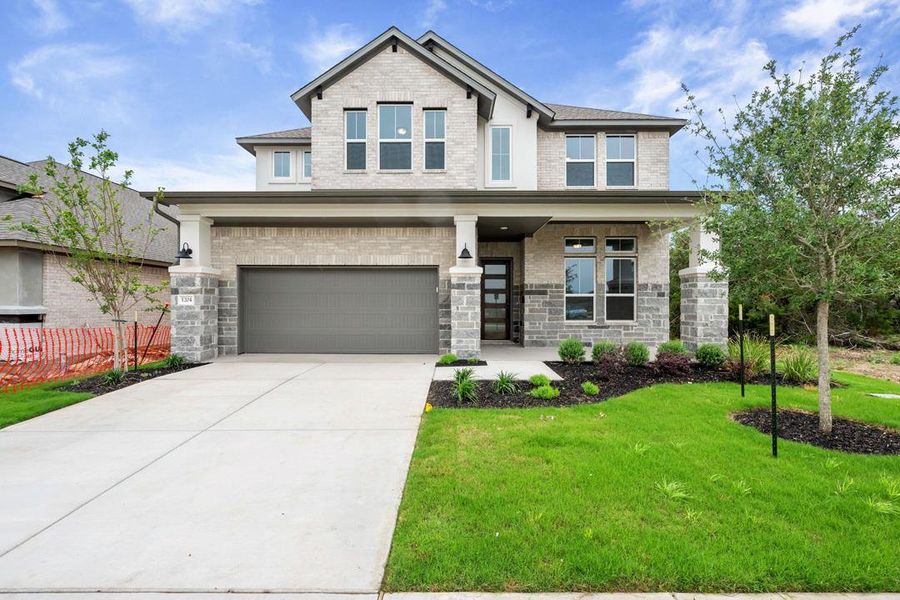 Front exterior of a new home in Wolf Ranch, Georgetown, TX, highlighting curb appeal (Image 1). Front exterior of a new home in Wolf Ranch, Georgetown, TX, highlighting curb appeal (Image 1).