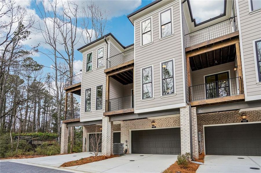 Front exterior of a new home in Byers Park, Alpharetta, GA, highlighting curb appeal (Image 1). Front exterior of a new home in Byers Park, Alpharetta, GA, highlighting curb appeal (Image 1).