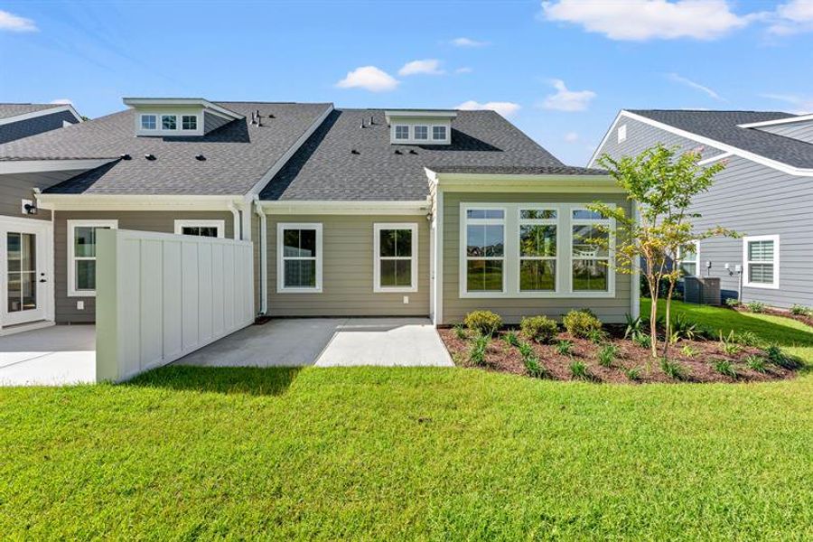 Exterior details and patio area of a home in Grande Dunes North Village, Myrtle Beach (Image 3).
