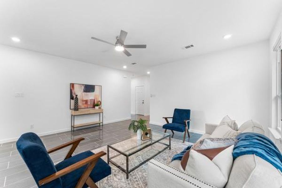 Living room featuring recessed lighting and ceiling fan Living room featuring recessed lighting and ceiling fan