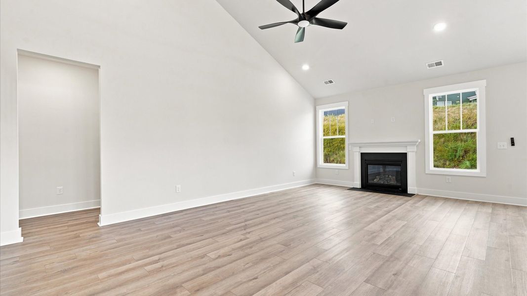 Notable two-story family room offering a grand yet inviting space for memorable everyday living by DRB Homes