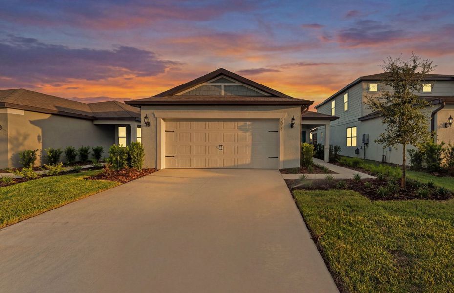 Front exterior of a new home in Twisted Oaks, Wildwood, FL, highlighting curb appeal (Image 1). Front exterior of a new home in Twisted Oaks, Wildwood, FL, highlighting curb appeal (Image 1).