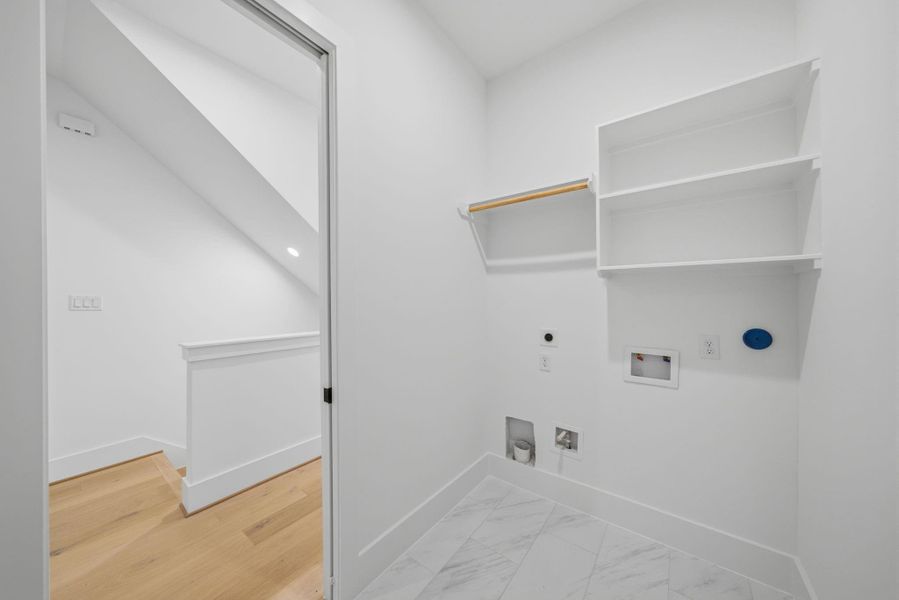 Laundry on second floor (Photos are of a previously completed home. Finishes are subject to change.)