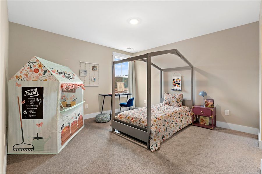 Bedroom 4. Staged for photography—furniture and décor not included