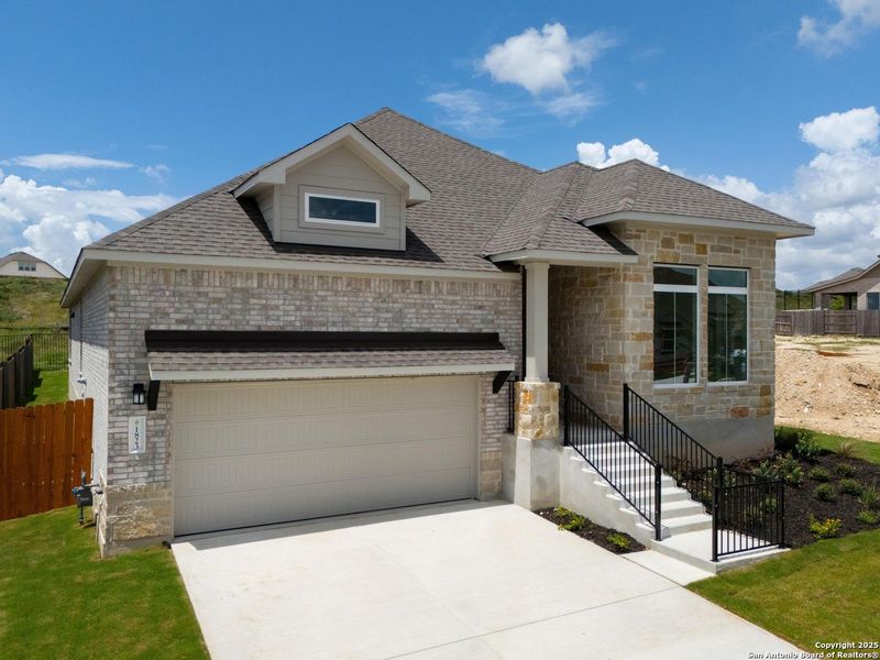 Front exterior of a new home in Meyer Ranch, New Braunfels, TX, highlighting curb appeal (Image 21).