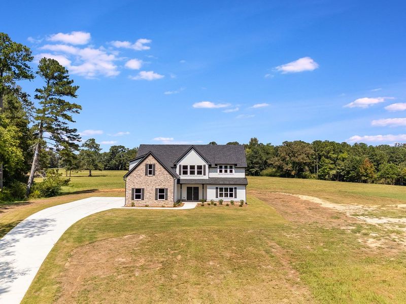 Front exterior of a new home in LOVVORN ESTATES, Carrollton, GA, highlighting curb appeal (Image 23).