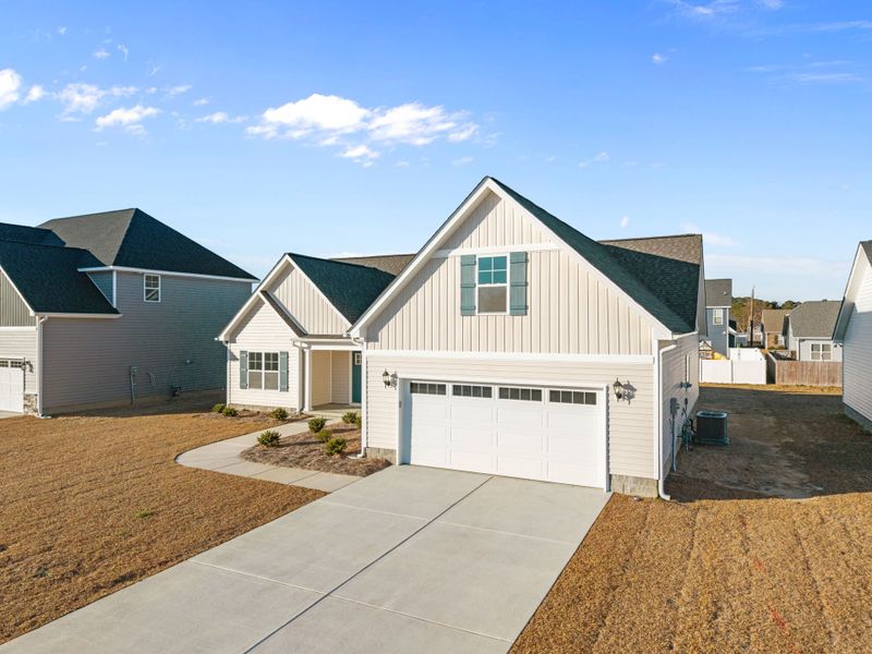 Front exterior of a new home in Arbor Hills South II, Greenville, NC, highlighting curb appeal (Image 20).