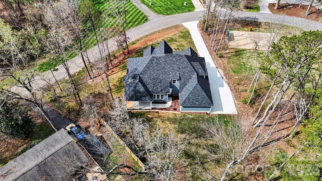 Front exterior of a new home in , Troutman, NC, highlighting curb appeal (Image 26).