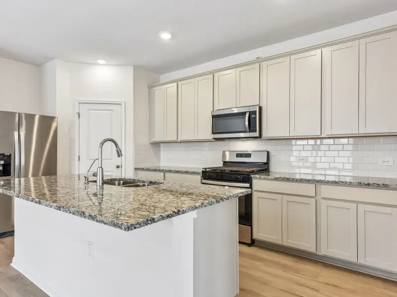 Furnished interior view inside a new home in Lexington Parke, Del Valle (Image 3).