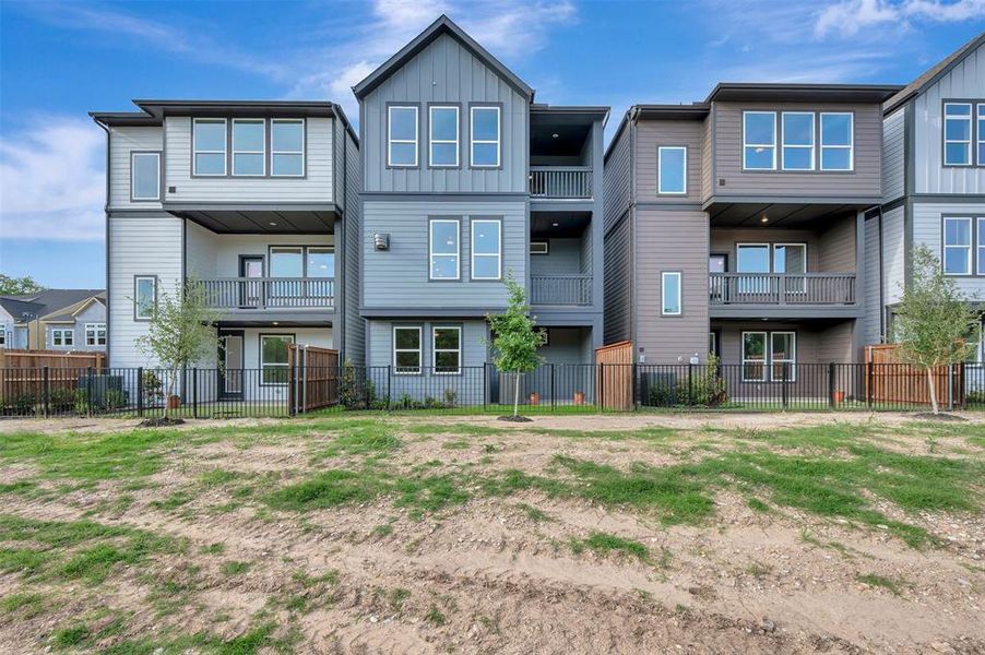 Modern townhome architecture featuring multi-story designs with private balconies and patios Modern townhome architecture featuring multi-story designs with private balconies and patios