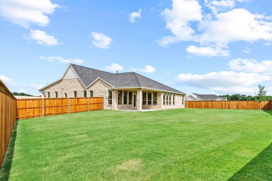 Front exterior of a new home in Chatham Reserve, Krugerville, TX, highlighting curb appeal (Image 2).