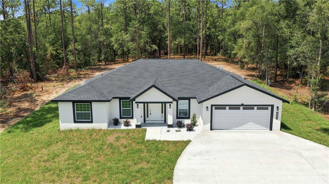 Front exterior of a new home in , Dunnellon, FL, highlighting curb appeal (Image 17). Front exterior of a new home in , Dunnellon, FL, highlighting curb appeal (Image 17).