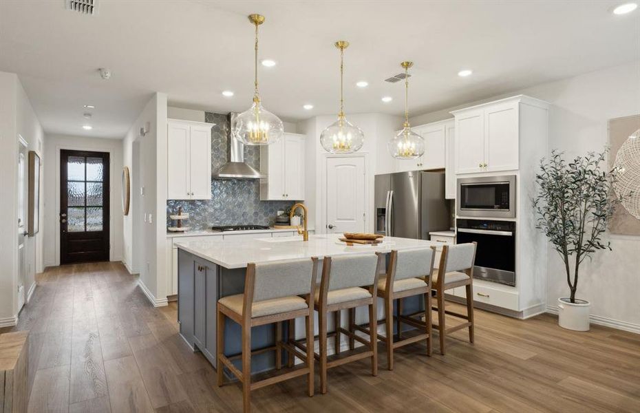 Spacious eat-in kitchen designed with a large island for dining *Model representation