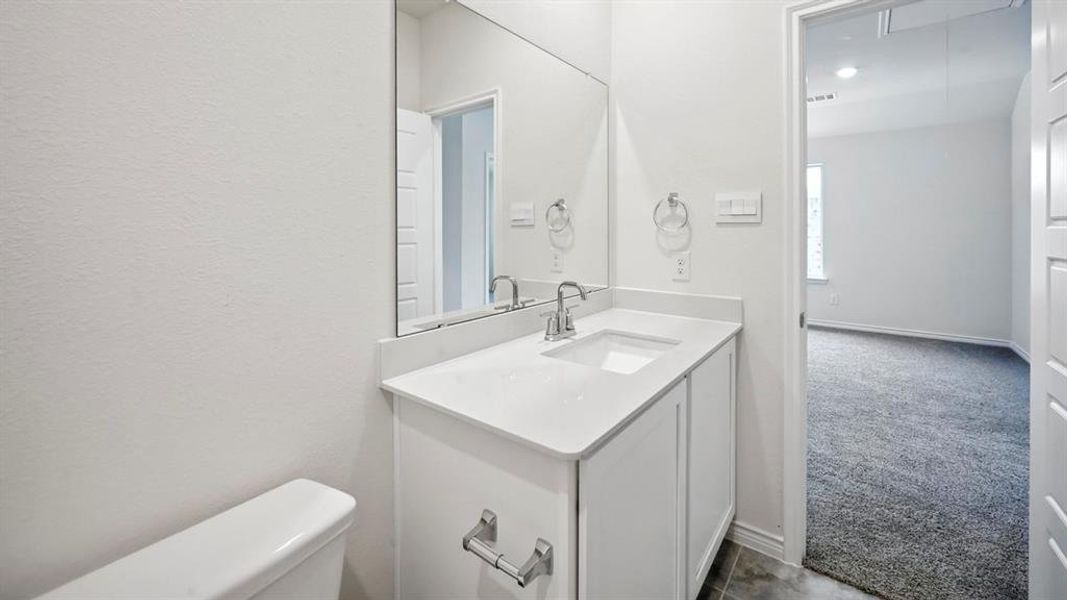 Bathroom with toilet and vanity