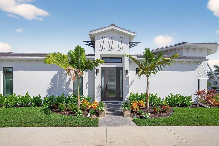 Front exterior of a new home in Aqua Single Family Homes, Bradenton, FL, highlighting curb appeal (Image 1).