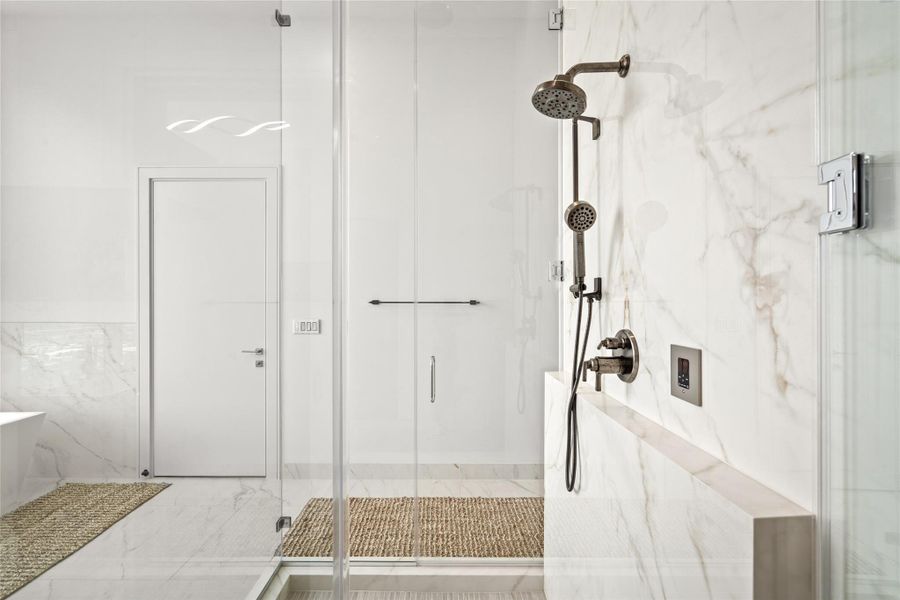 Primary bath retreat features steam shower and sauna.