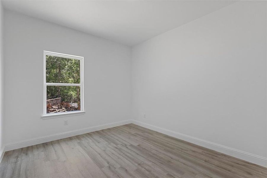 Spare room featuring light hardwood / wood-style flooring