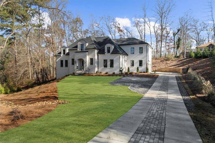 Front exterior of a new home in , Roswell, GA, highlighting curb appeal (Image 25). Front exterior of a new home in , Roswell, GA, highlighting curb appeal (Image 25).
