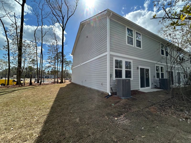 Exterior details and patio area of a home in Windward Village, Summerville (Image 3).