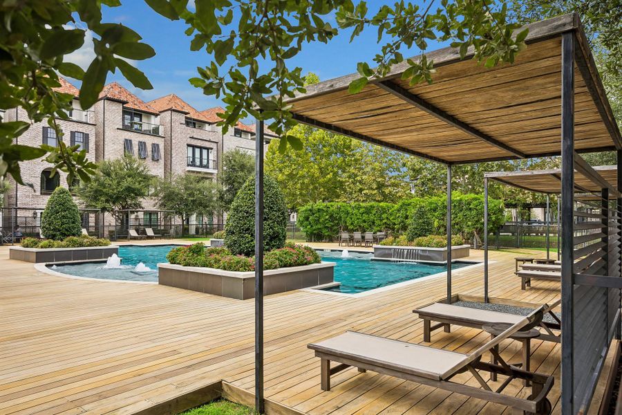 Ravenna’s resort-style pool offers shaded lounging areas surrounded by lush landscaping.