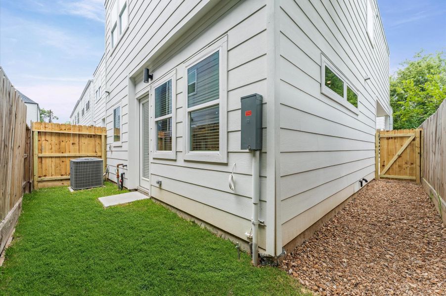 This charming small backyard offers a cozy outdoor escape, thoughtfully arranged to maximize space and comfort. Whether framed by lush greenery, a petite patio, or a few well-placed planters, the area invites relaxation and connection with nature.