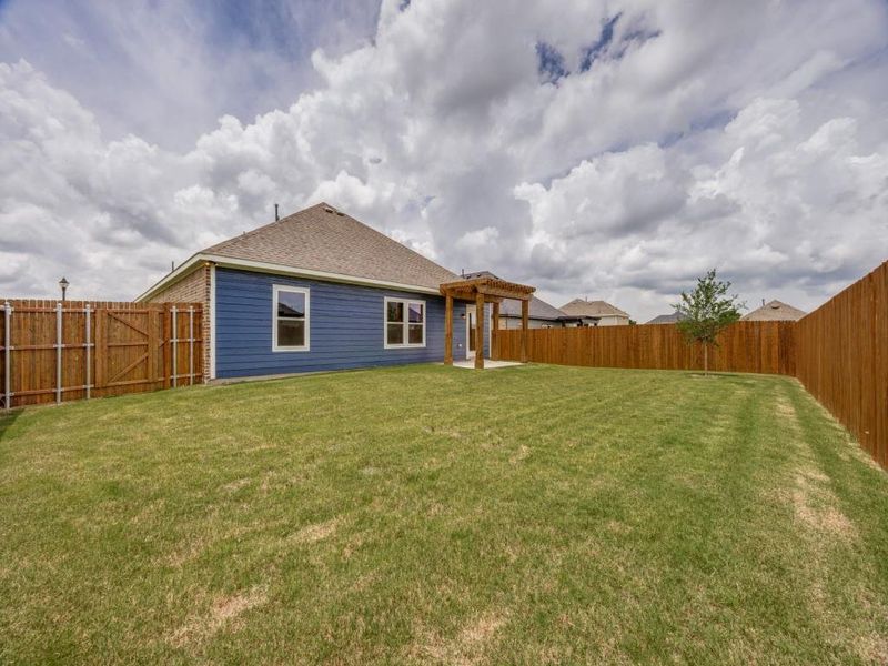 Exterior details and patio area of a home in Pebblebrook, Sherman (Image 14).