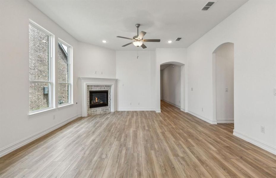 Spacious gathering room with fireplace *real home pictured