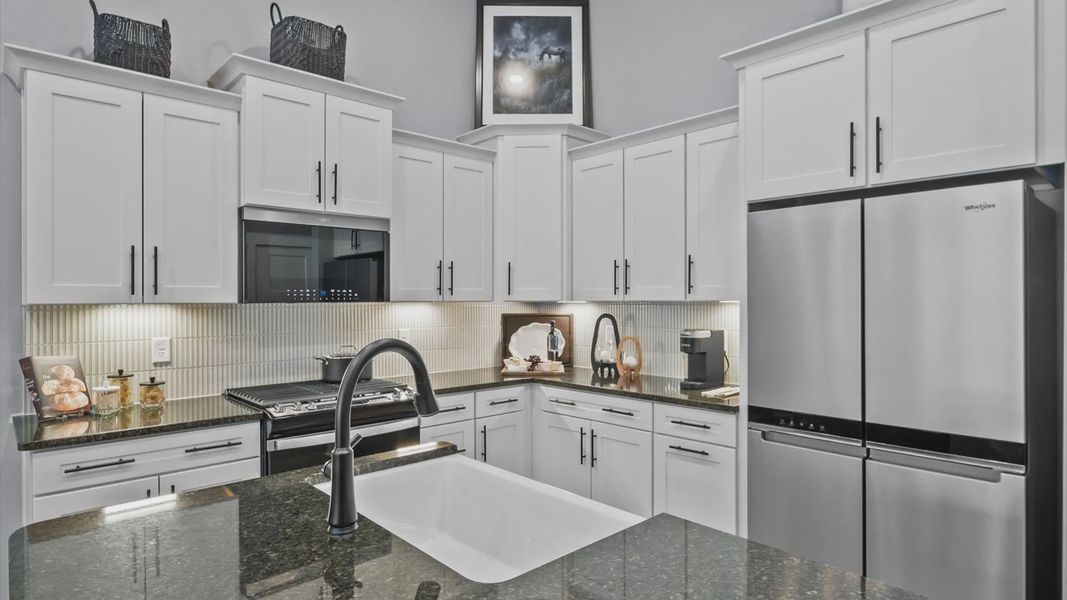 Modern kitchen with streamlined island for easy prep, storage, and gathering