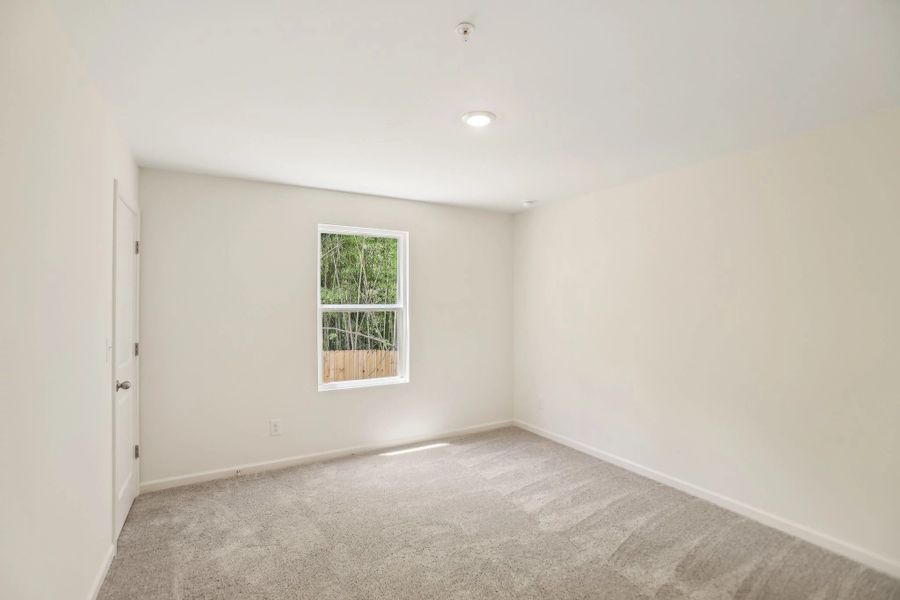 Representative unfurnished interior of a home built from the Triton by Starlight Homes in Kendall Grove, McDonough (Image 21).