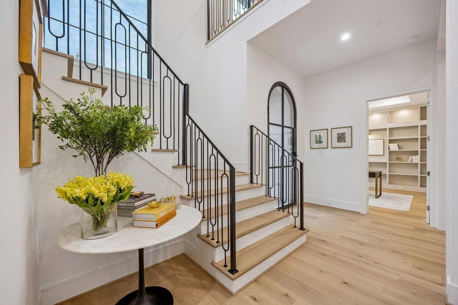 Beautiful inviting foyer and stunning staircase.