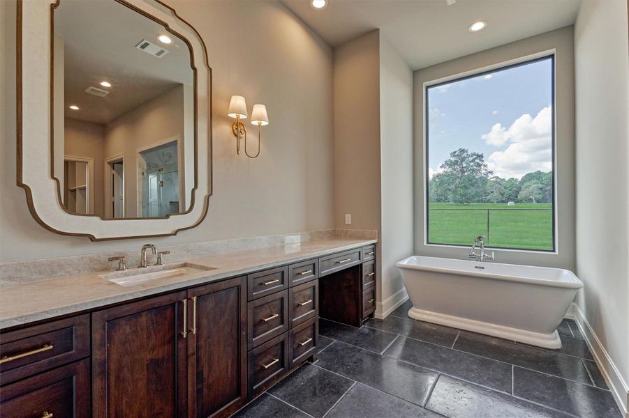 Gorgeous stand alone tub, seated vanity and designer lighting/mirrors. Gorgeous stand alone tub, seated vanity and designer lighting/mirrors.