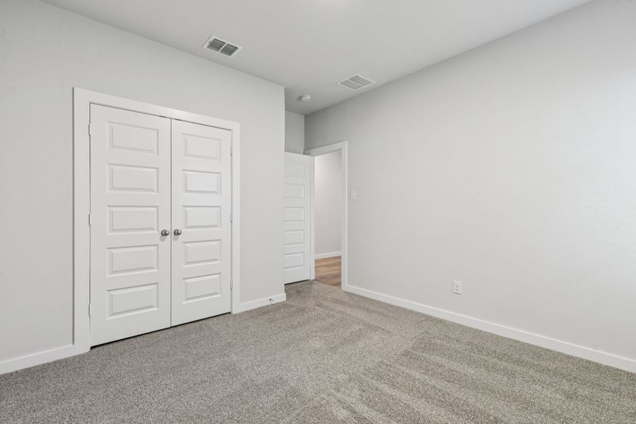 Bedroom in the Oscar home plan by Trophy Signature Homes – REPRESENTATIVE PHOTO Bedroom in the Oscar home plan by Trophy Signature Homes – REPRESENTATIVE PHOTO