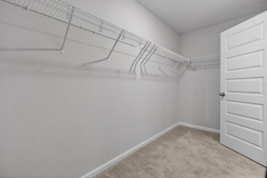 Spacious, unfurnished interior of a new home in Lindera Preserve at Cane Bay Plantation, Summerville (Image 24).