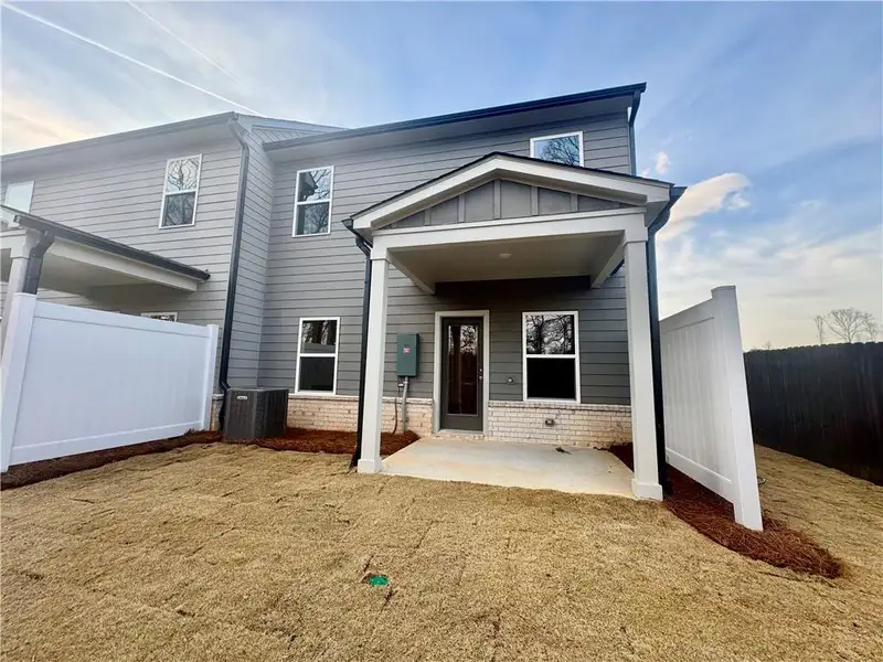 Exterior details and patio area of a home in Eastlyn Crossing, Flowery Branch (Image 16).