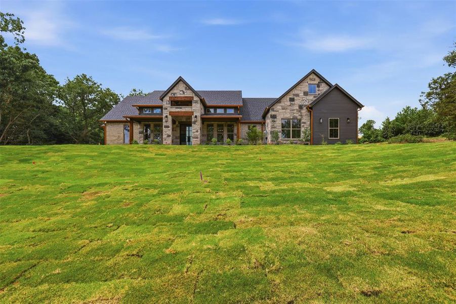 Front exterior of a new home in , Granbury, TX, highlighting curb appeal (Image 27). Front exterior of a new home in , Granbury, TX, highlighting curb appeal (Image 27).