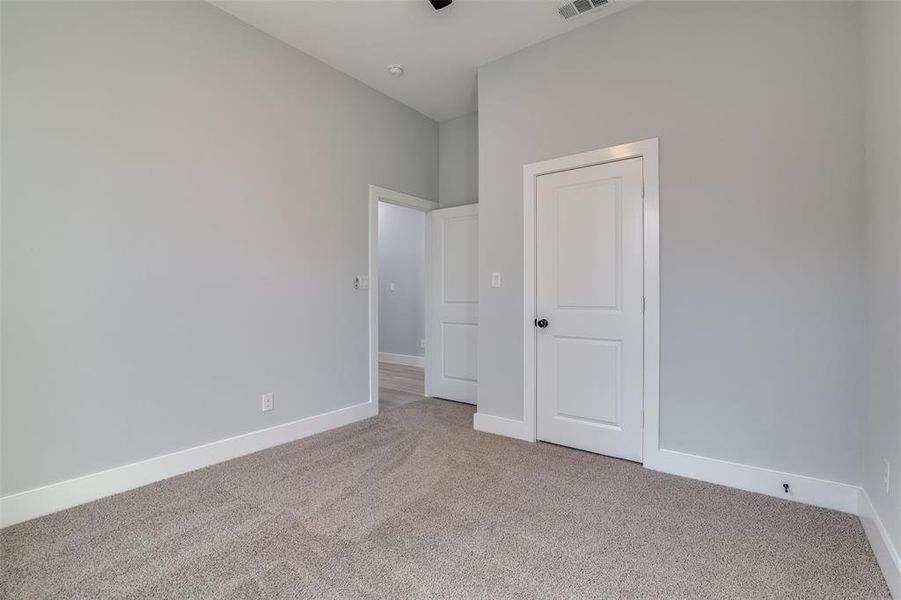 Unfurnished bedroom featuring carpet