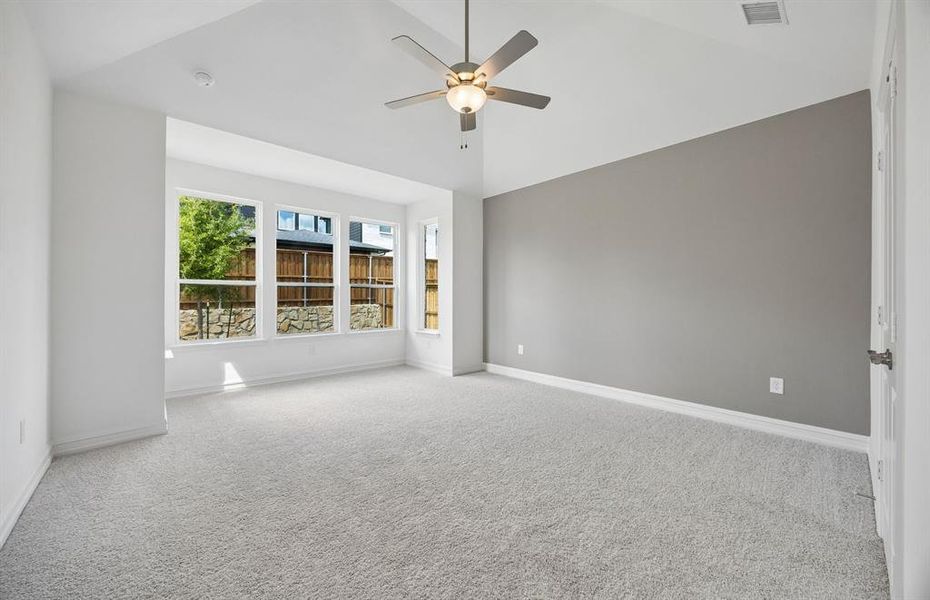 Primary suite with large windows