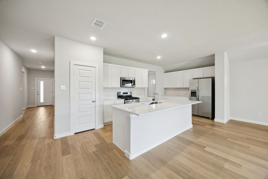 Kitchen in the Heisman home plan by Trophy Signature Homes – REPRESENTATIVE PHOTO Kitchen in the Heisman home plan by Trophy Signature Homes – REPRESENTATIVE PHOTO