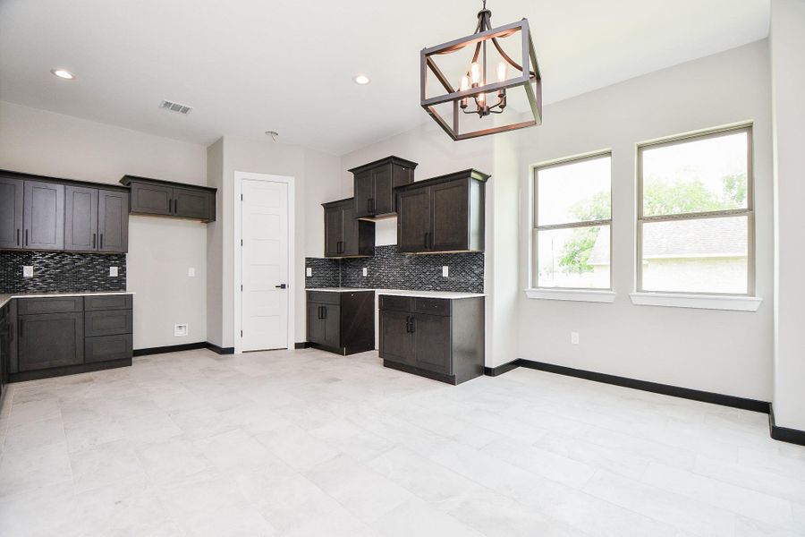 Kitchen and Breakfast area is huge! Lots of Cabinets and Counterspace and open area for breakfast. Kitchen and Breakfast area is huge! Lots of Cabinets and Counterspace and open area for breakfast.