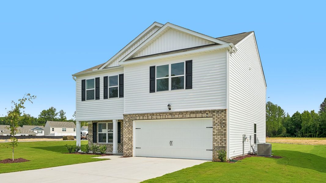 Front exterior of a new home in Mangum Farms, Stem, NC, highlighting curb appeal (Image 2).